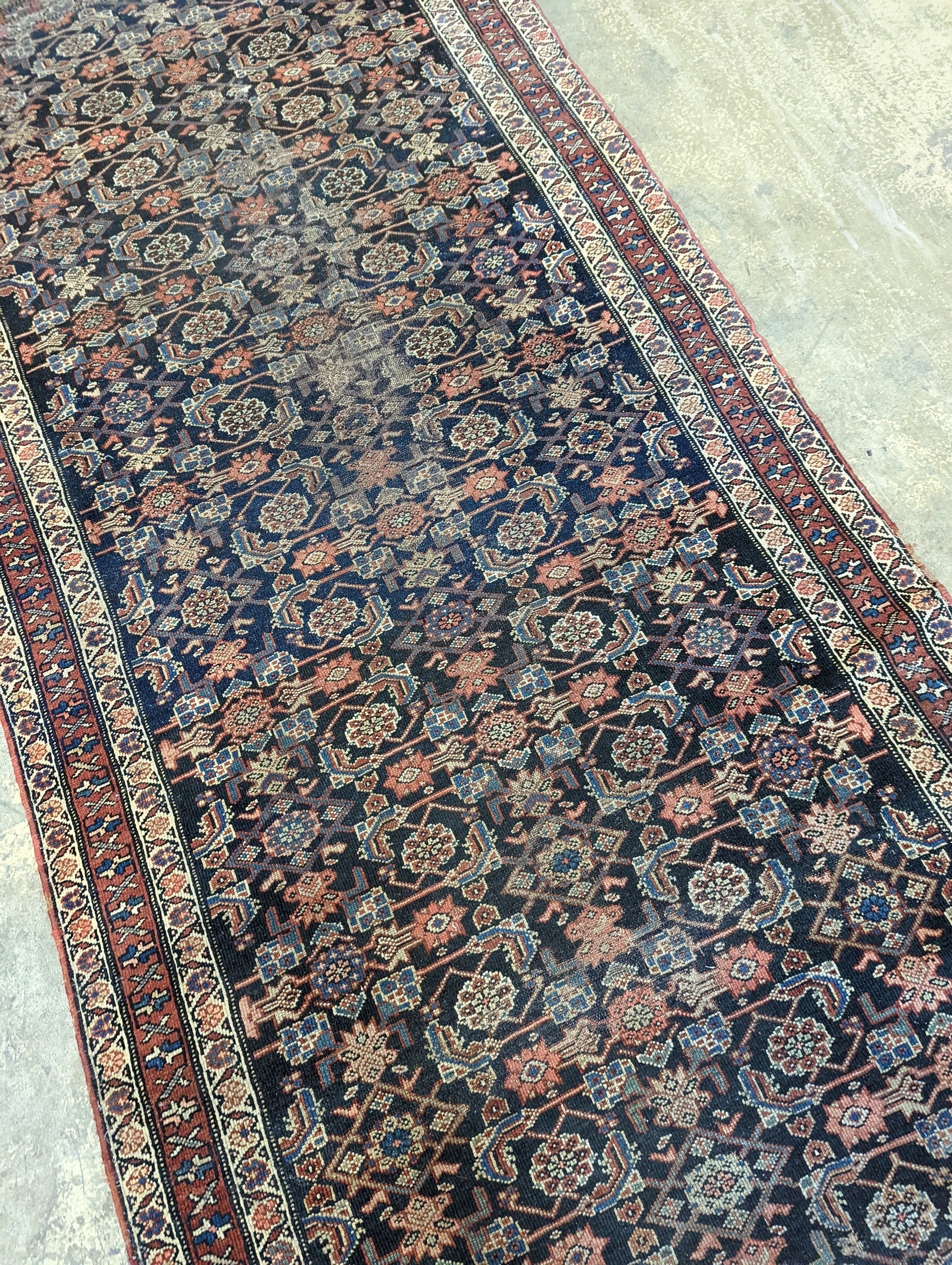 An antique Shirvan blue ground runner, 470 x 116cm